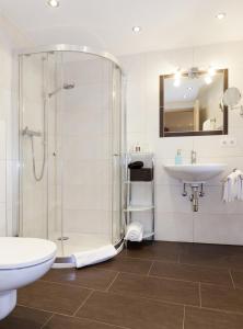 a bathroom with a shower and a sink at Roslerhof in Inzing