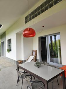 a dining room with a table and chairs at Villa in Precollina in Turin