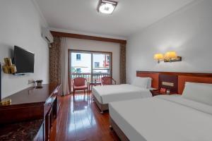 Hunan New Pipaxi Hotel客房内的一张或多张床位