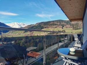a balcony with a table and a view of the mountains at Haus Berghof in Gries am Brenner