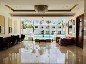 a living room with a lobby with a pool at Hotel Chandela Khajuraho in Khajurāho