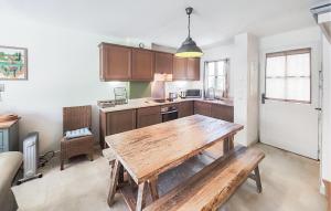 a kitchen with a wooden table in a room at Stunning Home In Saint-Laurent-De-La-Cabrerisse in Saint-Laurent-de-la-Cabrerisse