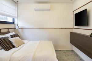 TV a/nebo společenská místnost v ubytování Mulan Hotel