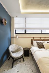 Postel nebo postele na pokoji v ubytování Mulan Hotel