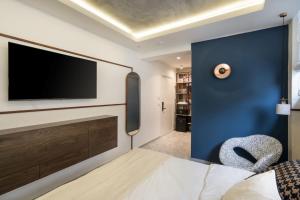 TV a/nebo společenská místnost v ubytování Mulan Hotel