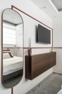 TV a/nebo společenská místnost v ubytování Mulan Hotel