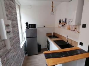 Кухня или мини-кухня в Appartement 50m² centre-ville
