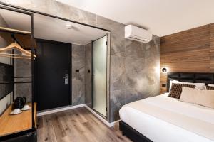 Postel nebo postele na pokoji v ubytování Mulan Hotel