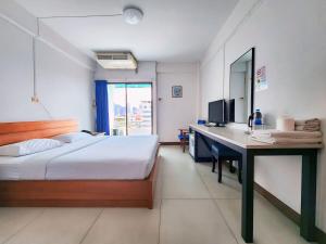 Postel nebo postele na pokoji v ubytování Siam Palace Hotel
