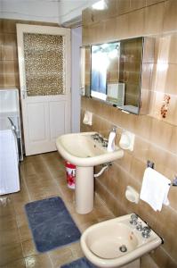 a bathroom with a sink and a mirror at CASA DEBORAH in Alliste
