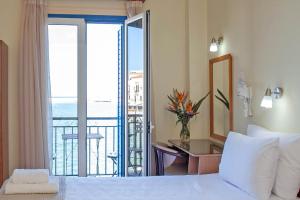 Postel nebo postele na pokoji v ubytování Lucia Hotel