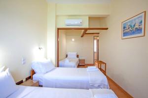 Postel nebo postele na pokoji v ubytování Lucia Hotel