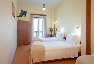 Postel nebo postele na pokoji v ubytování Lucia Hotel