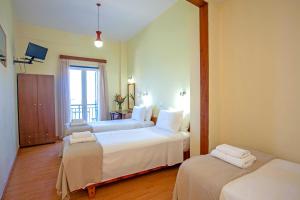 Postel nebo postele na pokoji v ubytování Lucia Hotel