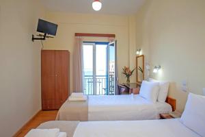 Postel nebo postele na pokoji v ubytování Lucia Hotel