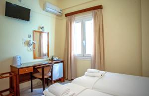 Postel nebo postele na pokoji v ubytování Lucia Hotel