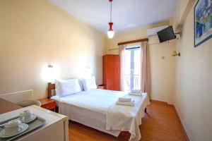 Postel nebo postele na pokoji v ubytování Lucia Hotel