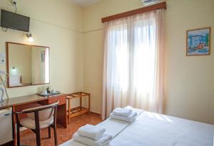 Postel nebo postele na pokoji v ubytování Lucia Hotel