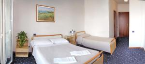 Postel nebo postele na pokoji v ubytování Medi Garden Hotel&Residence