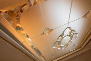 a room with a chandelier on the ceiling at Duomo Boutique Hotel in Chioggia
