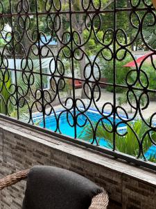 a chair sitting in front of a window at Heidi’s Beach Stay in Mombasa