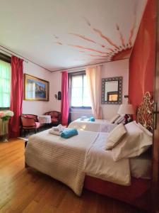 a bedroom with a large bed with a fish on the ceiling at Villa Sofia in Sirtori