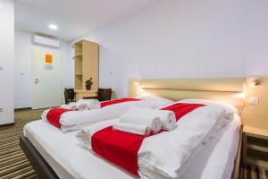 Postel nebo postele na pokoji v ubytování ParkCity rooms