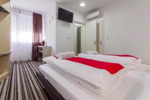 Postel nebo postele na pokoji v ubytování ParkCity rooms