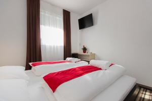 Postel nebo postele na pokoji v ubytování ParkCity rooms