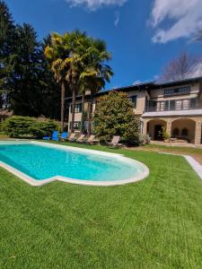 a swimming pool in the yard of a house at Villa Sofia in Sirtori