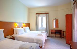 Postel nebo postele na pokoji v ubytování Lucia Hotel + 37 fotografií