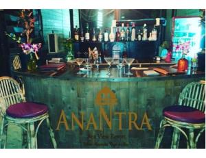 a bar with chairs and a sign that says amarna at Anantra Sea View Resort, Agonda, Goa in Agonda