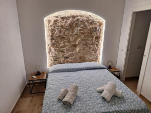 Postel nebo postele na pokoji v ubytování Dommu Amsicora