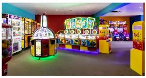 a room with many arcade games in a store at HARTS Holiday Park Home in Leysdown-on-Sea