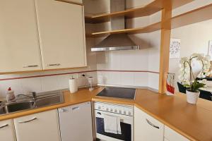 a kitchen with a sink and a stove top oven at Sea view el veril in Adeje