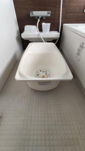 a bathroom with a toilet and a sink at iruka - Vacation STAY 19721v in Nago