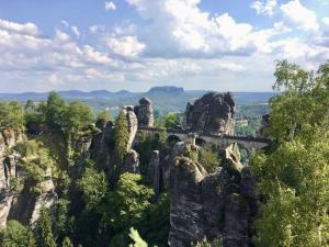 a bridge on a mountain with trees and rocks at Feriensuite Tosca im Kuckuckswinkel in Schöna +5 photos