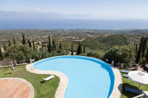 a large swimming pool with a view of a city at Skyline Parorama in Mathía