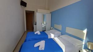 Postel nebo postele na pokoji v ubytování Hotel Canarco