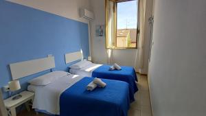 Postel nebo postele na pokoji v ubytování Hotel Canarco