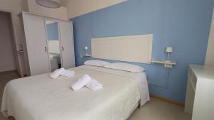 Postel nebo postele na pokoji v ubytování Hotel Canarco
