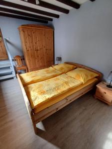 a bedroom with a large bed with a wooden frame at Ferienhaus In der Hohl in Cochem