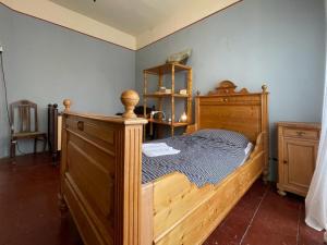 a bedroom with a wooden bed in a room at Spurensucher Quartier in Usedom Town