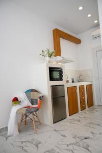Kuchyň nebo kuchyňský kout v ubytování Platanos Apartments