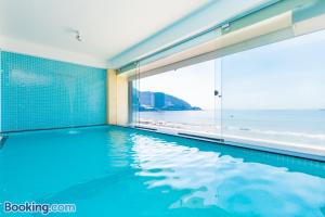a swimming pool with a view of the ocean at WhiteDay Villages SÁT BIỂN Trần Phú in Vung Tau