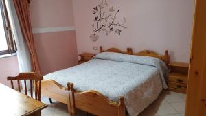 Postel nebo postele na pokoji v ubytování Hotel 4 Mori