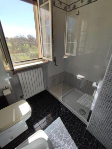 a bathroom with a shower and a toilet and a sink at Contrada Macchia B&B in Tricase