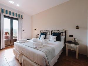 Postel nebo postele na pokoji v ubytování Hotel Boutique Cerro del Sol Adults only recommended
