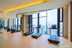 a gym with a bunch of exercise bikes in a room at NEW - Axon Bukit Bintang Pavilion KL KLCC TRX by Gomain in Kuala Lumpur