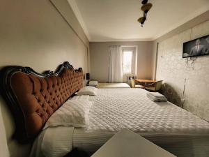 Säng eller sängar i ett rum på Seringal Hotel